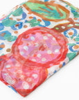 Close-up of the folded Bushtucker luxury cashmere scarf by Sally White featuring a colorful artwork print.