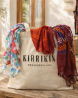 Close-up of the Kirrikin tote bag showing durable fabric texture, sturdy handles, and intricate First Nations graphic design.