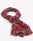 Storms in the Pilbara Silk Chiffon Scarf styled in a knot on a white background, showcasing colorful artwork by Kaye White.