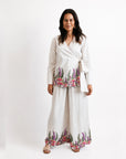 the Princess Gum wrap blouse highlighting intricate First Nations graphic artwork and delicate pink floral print details.