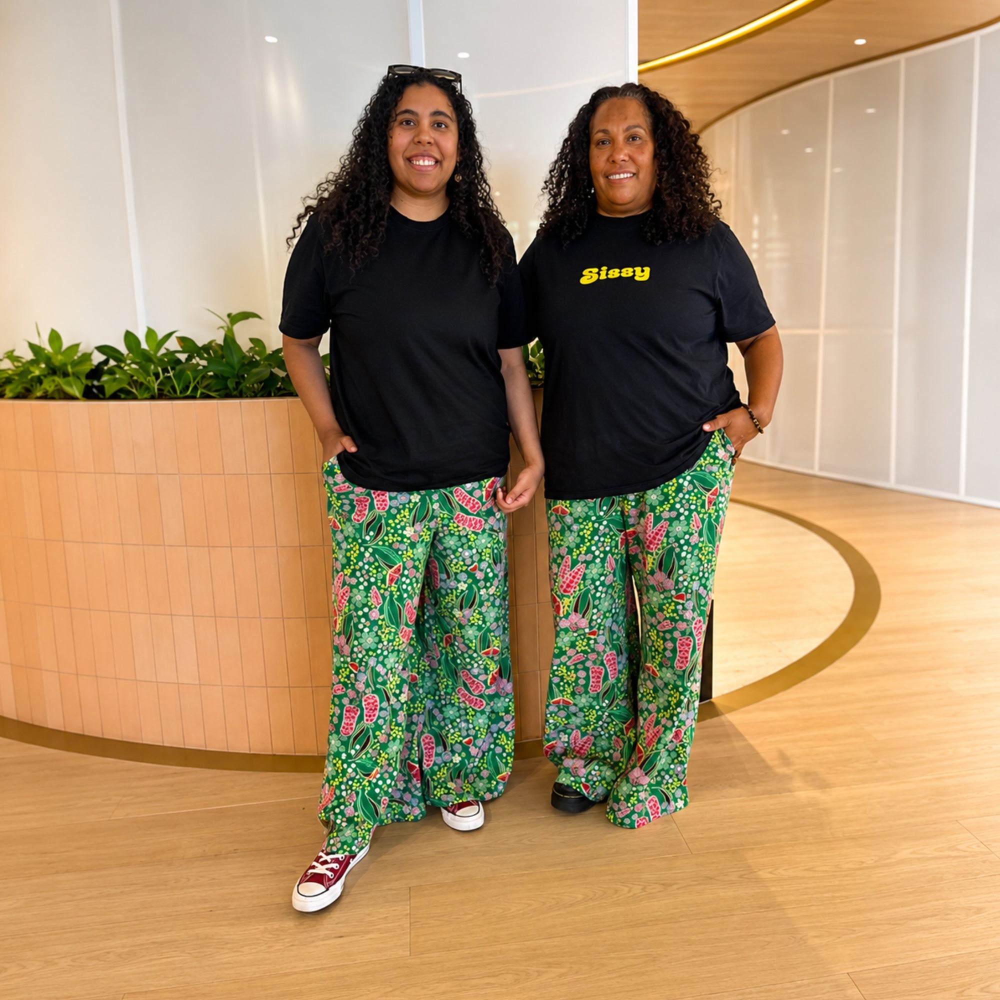 Front view of the Kirrikin Boodja print pants in sustainable fabric featuring vibrant Indigenous Australian artwork.