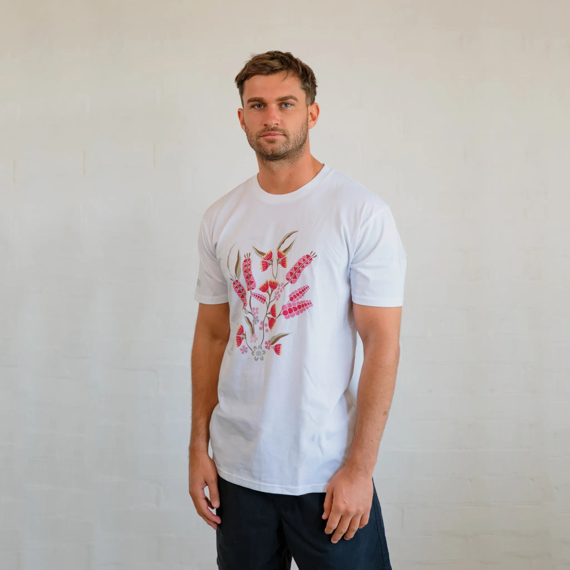 Flat lay view of the unisex Boodja t-shirt in sustainable cotton featuring modern First Nations inspired line art.