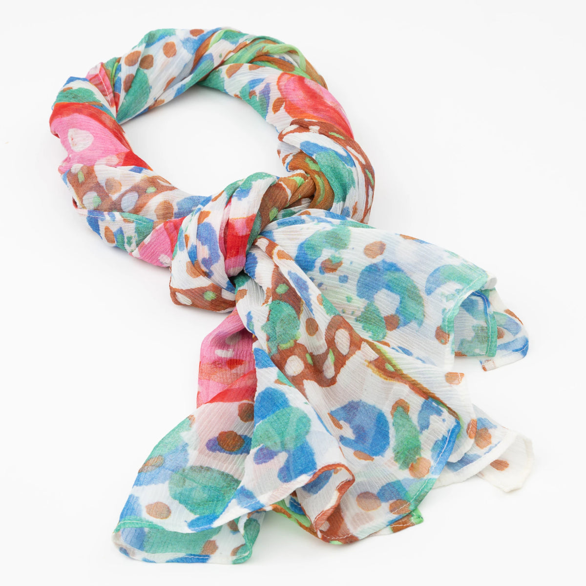 Bushtucker luxury cashmere scarf designed by Sally White tied in a loose knot against a white background.