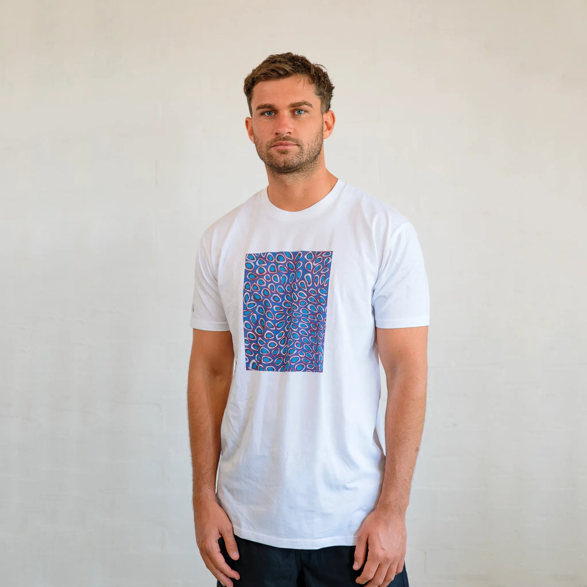 Detailed view of the Pilbara Wildflower shirt print showing intricate native Australian floral artwork and vibrant desert colors.