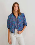 Pilbara Wildflowers Bomber Jacket featuring vibrant native Australian wildflower artwork inspired by the Pilbara region.