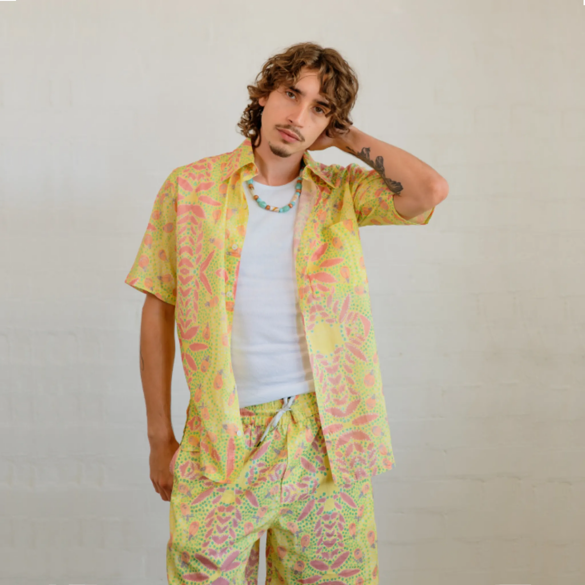 Lightweight and breathable men's resort-style short sleeve shirt in the Honey Ants pattern by artist Sally White.