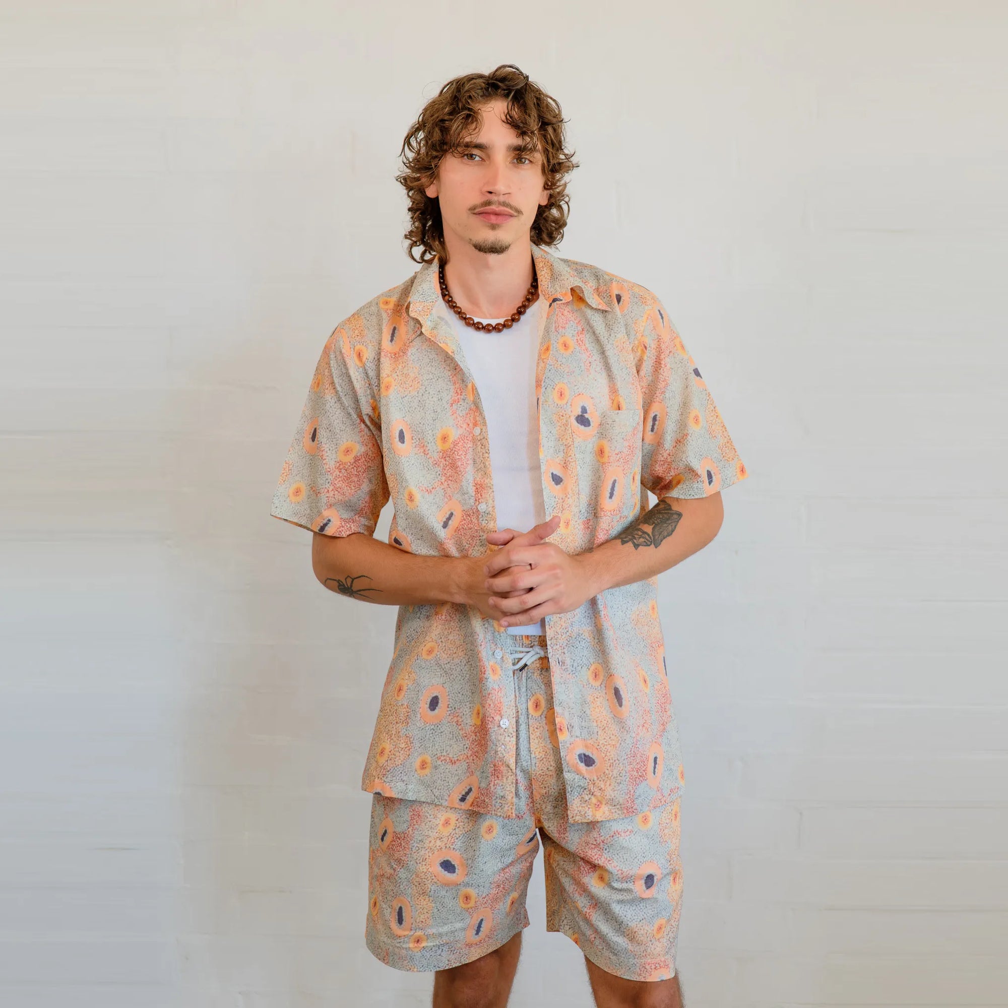 Men's Short Sleeve Shirt in Dry Country print featuring authentic First Nations artwork by Sheryl Hicks for Kirrikin.
