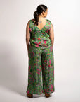 Rear full-length view showcasing the fluid drape and wide-leg fit of the Sophie Pants Boodja in green Indigenous print.