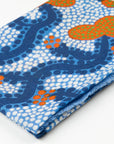 Close-up of folded Split Jack 100% Cashmere Scarf showing the detailed blue, white, and orange Indigenous art pattern by Kaye White.
