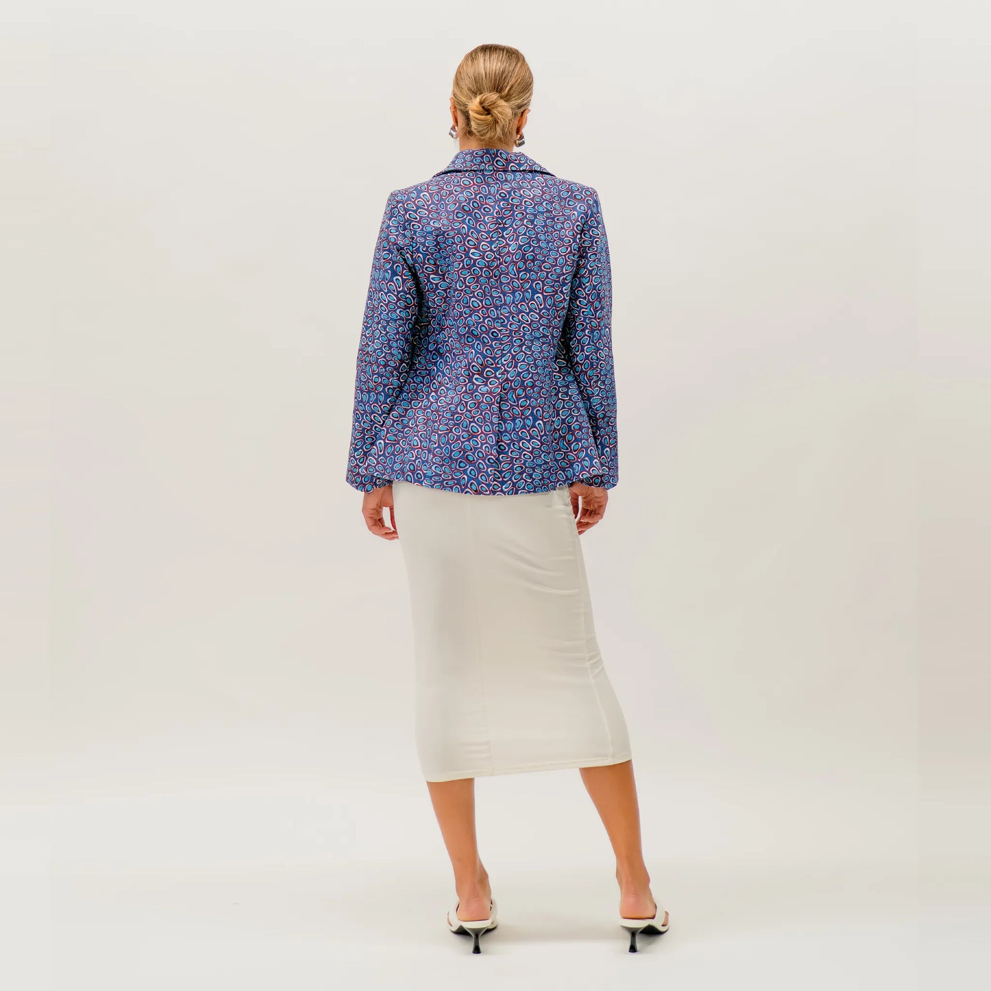 Premium Wildflowers in the Pilbara Jacket showcasing authentic Aboriginal artwork by Carol Martin inspired by the native flora of Western Australia.